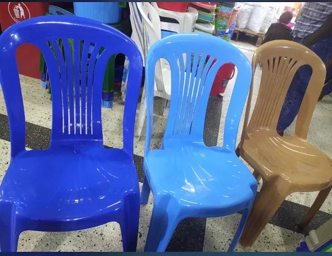 Dark-blue, light-blue and brown plastic chairs with slotted backs